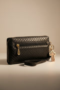 Black wallet with gold accents on a light gray background