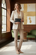 Elegant Woman in Light Outfit with Black Clutch